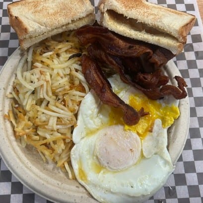 2 Eggs, Bacon or Sausage, Hash Browns & Toast.